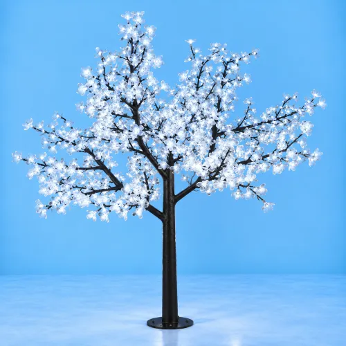 Árbol LED de flores blancas sobre fondo azul