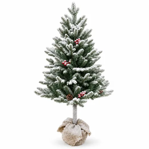 Árbol navideño nevado con bayas rojas y piñas